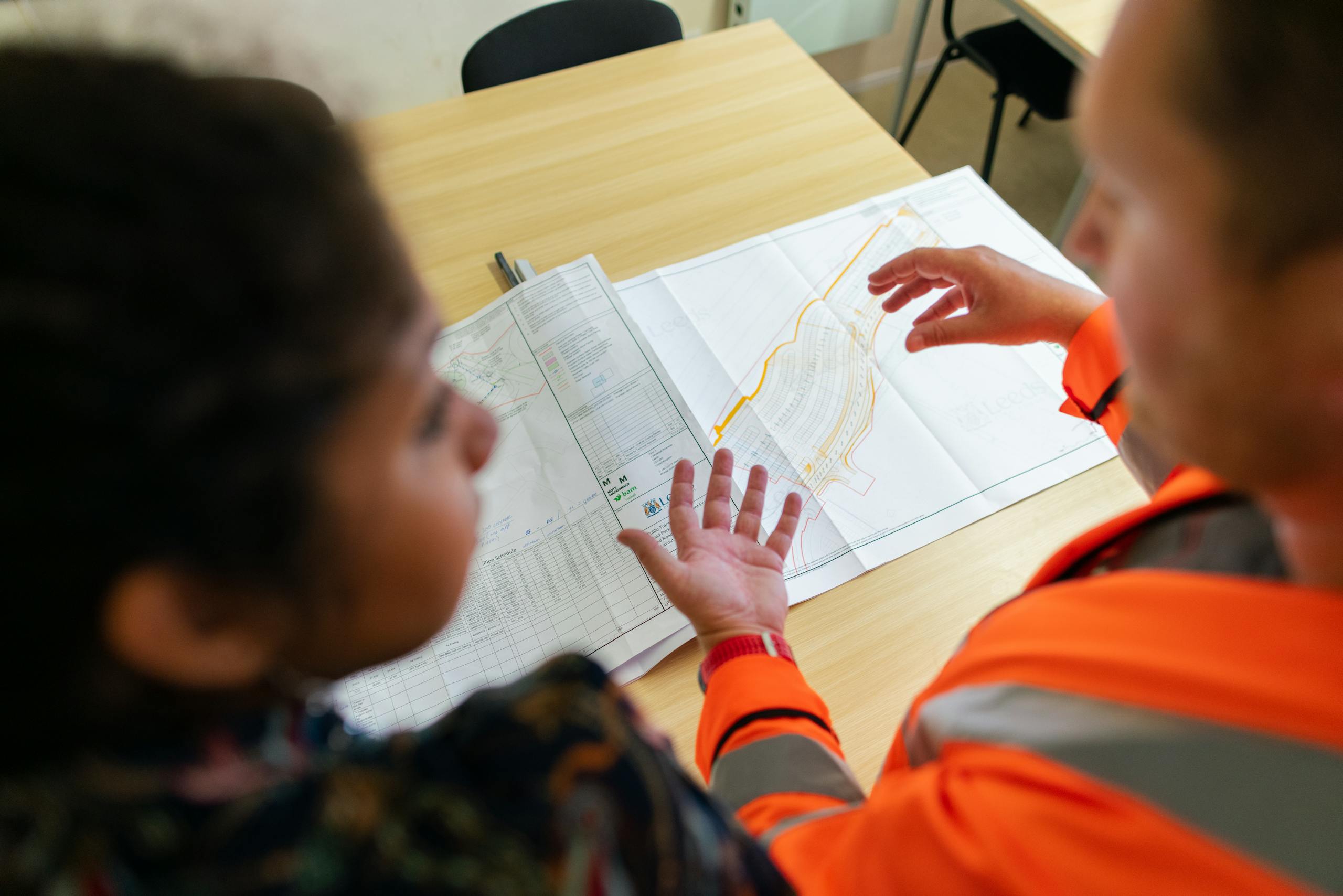 Engineers reviewing construction plans